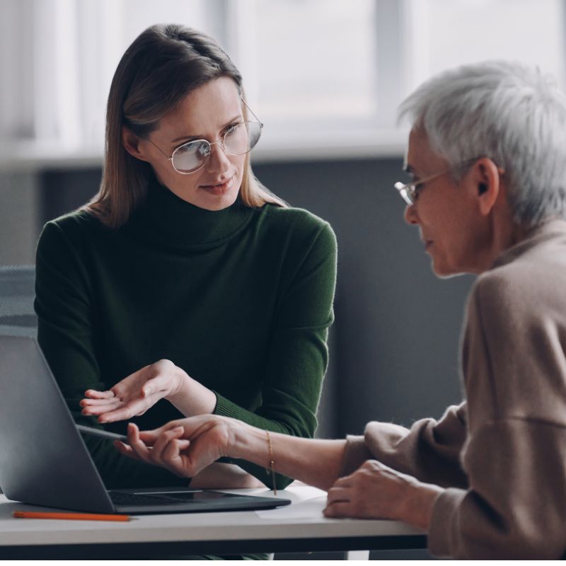 Healthcare consultant meeting with a client to discuss medical practice management and consulting services