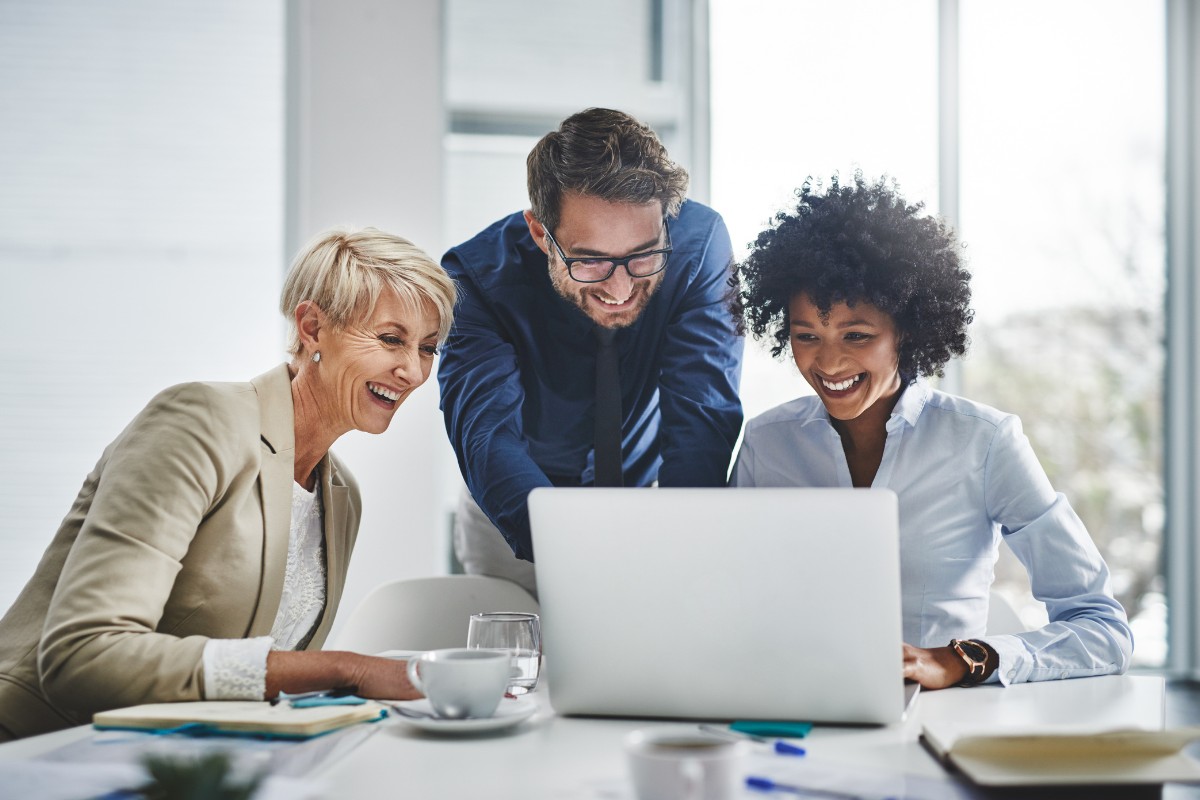 Healthcare professionals reviewing medical billing and revenue cycle management data on a laptop for practices in virginia beach and across the united states
