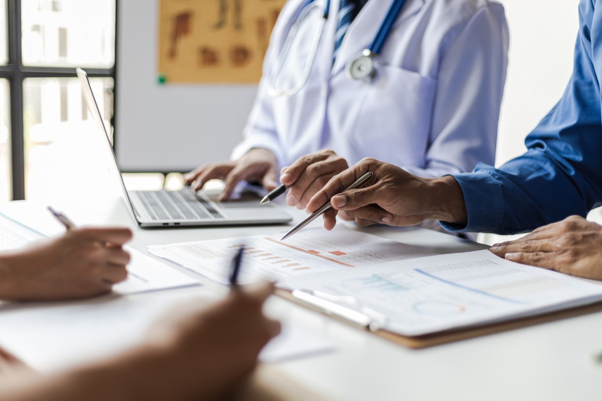 Healthcare professionals reviewing medical billing reports and revenue cycle management data for providers in virginia beach and across the united states