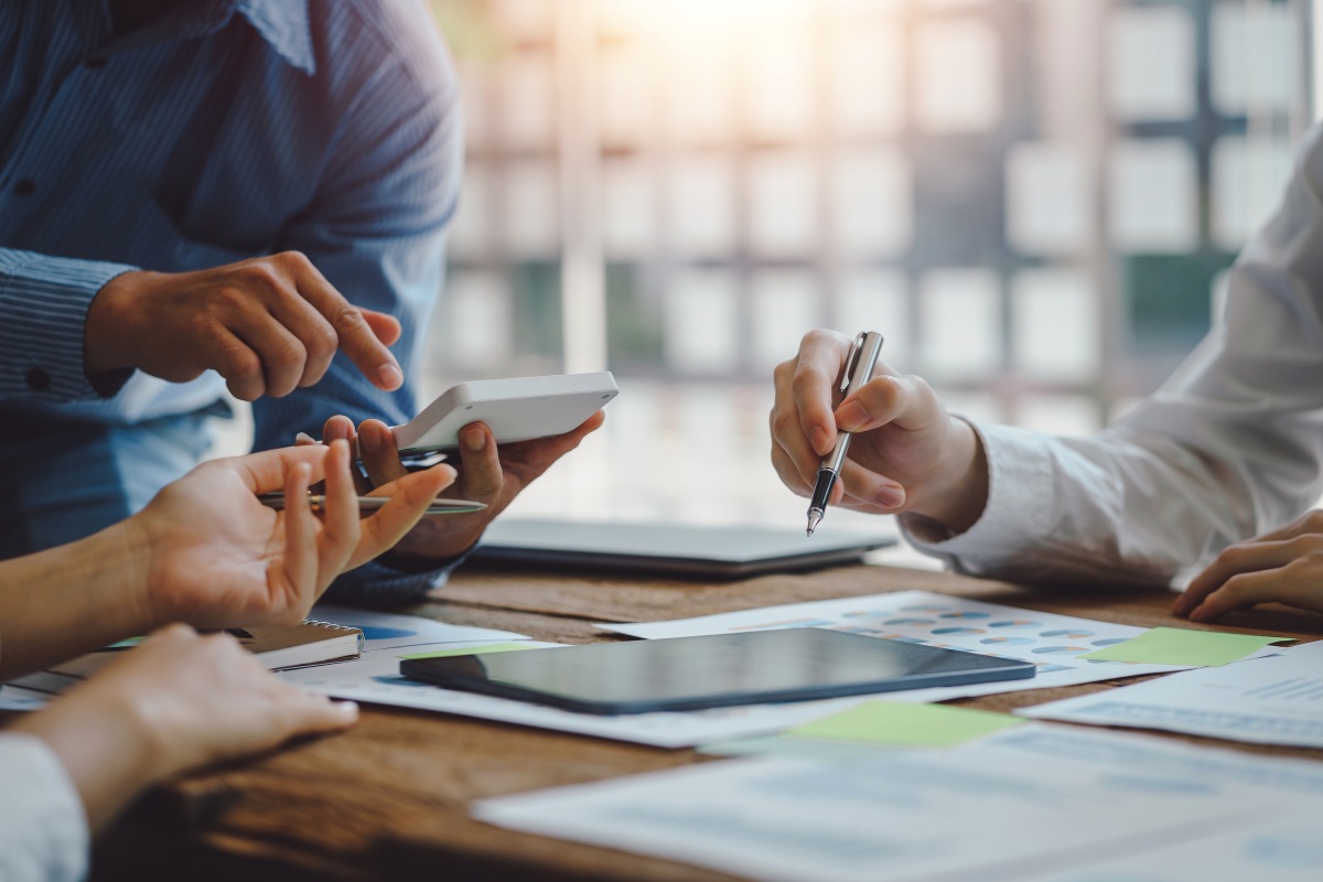 Healthcare consultants reviewing medical billing reports and working on healthcare compliance consulting for providers in virginia beach and across the united states