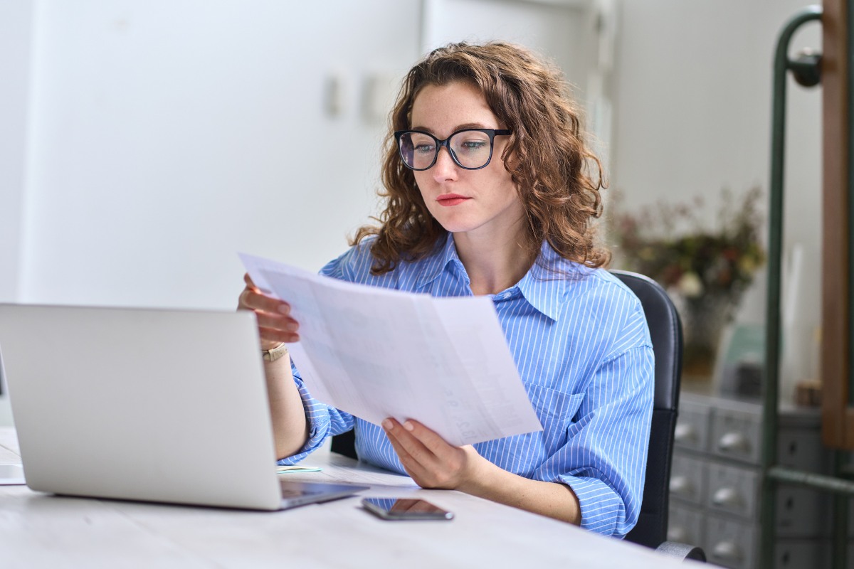 Medical billing specialist reviewing accounts receivable and healthcare financial documents for providers in virginia beach and across the united states