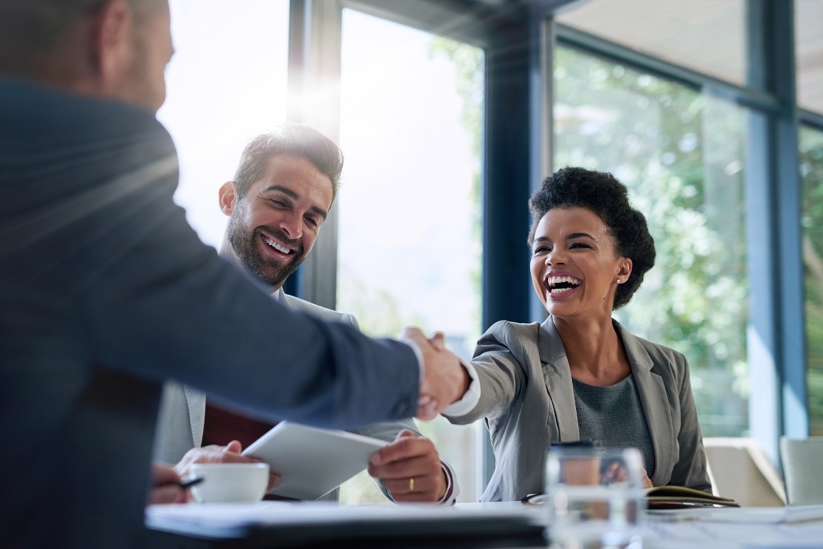 Healthcare professionals shaking hands during a medical billing and practice management consultation in virginia beach and across the united states