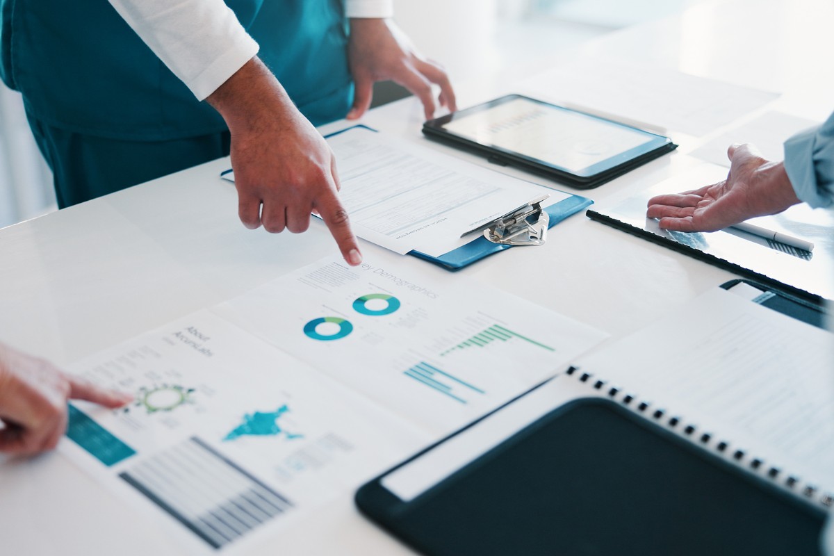 Healthcare professionals reviewing accounts receivable reports and medical billing data for revenue cycle management in virginia beach and across the united states